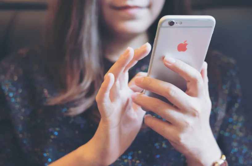 A woman using her cellphone.